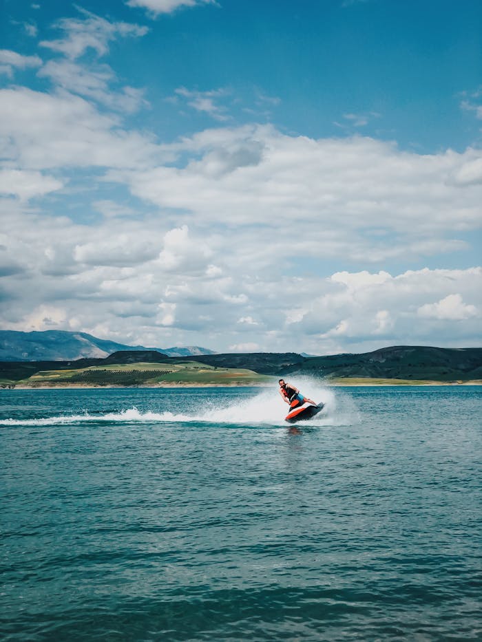 Scenic view of a person enjoying a jet ski ride on a lake in Adıyaman, Turkey.